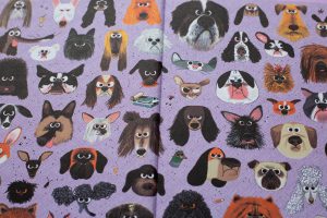 Schutblad vol illustraties van verschillende honden en plattekat