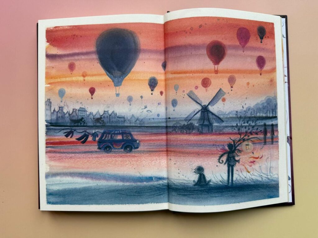 luchtballonnen in oranje lucht met molen