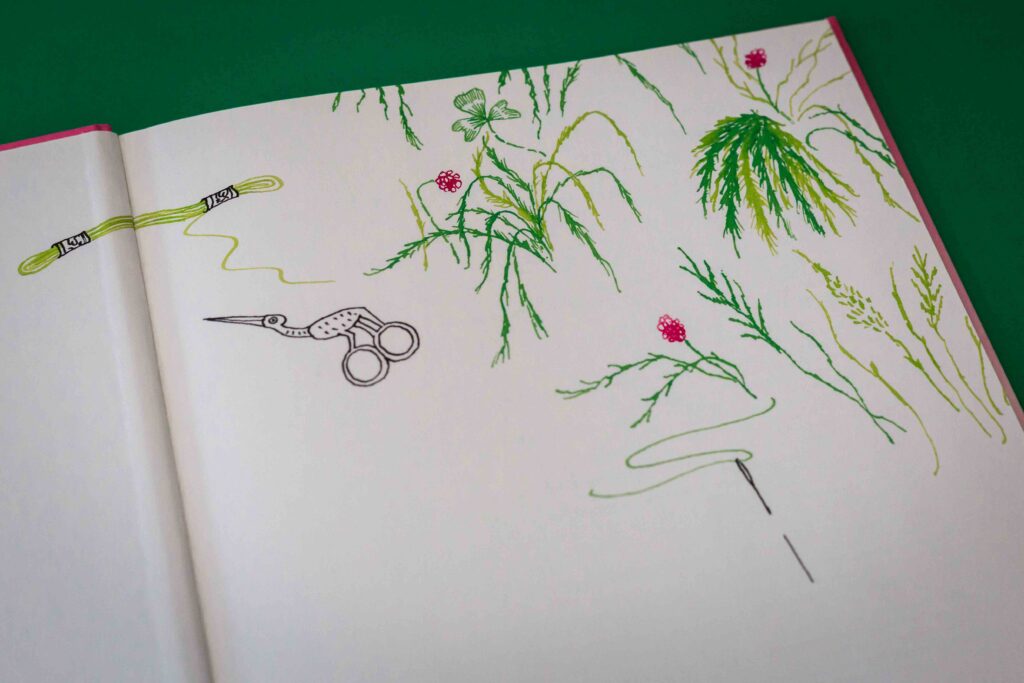 schutblad met naald draad en planten