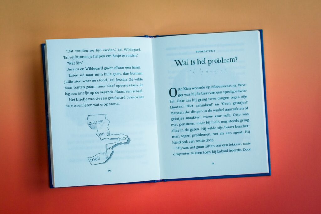 bladspiegel 2v3 p20-21 met kleine illustratie van het gevonden nare briefje