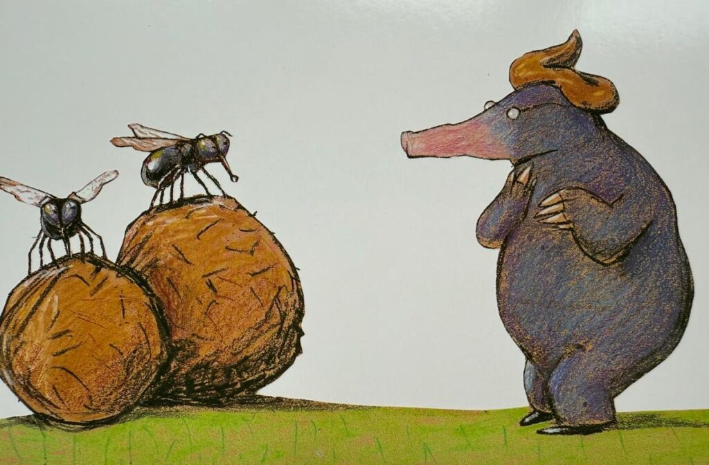 mol met een dol op zijn hoofd en een strontvlieg